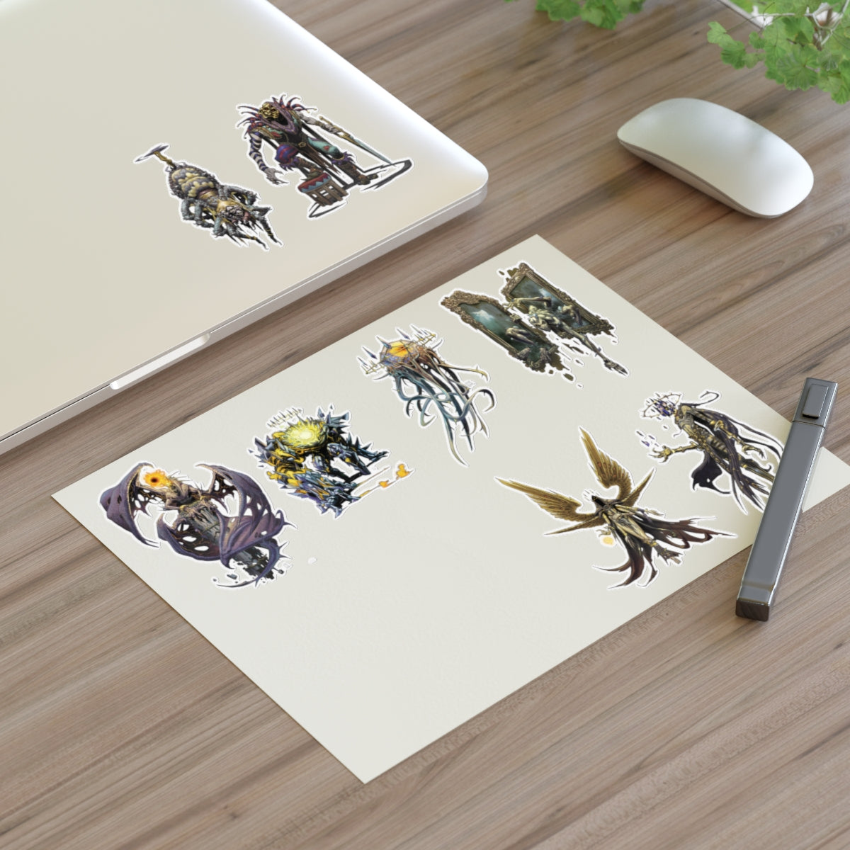 A sheet of fantasy character art prints or stickers featuring eight distinct gothic and horror-themed illustrated figures on a wooden background.